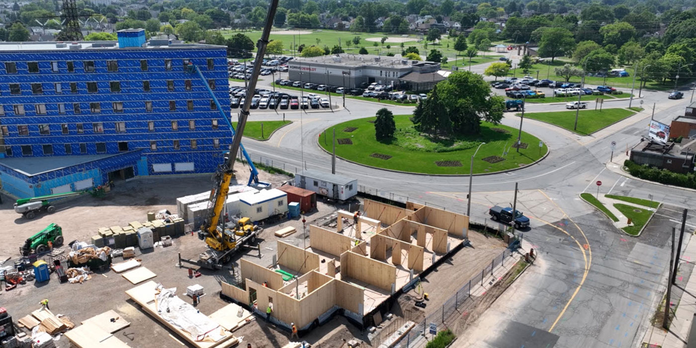First-floor timber walls erected with a crane on site