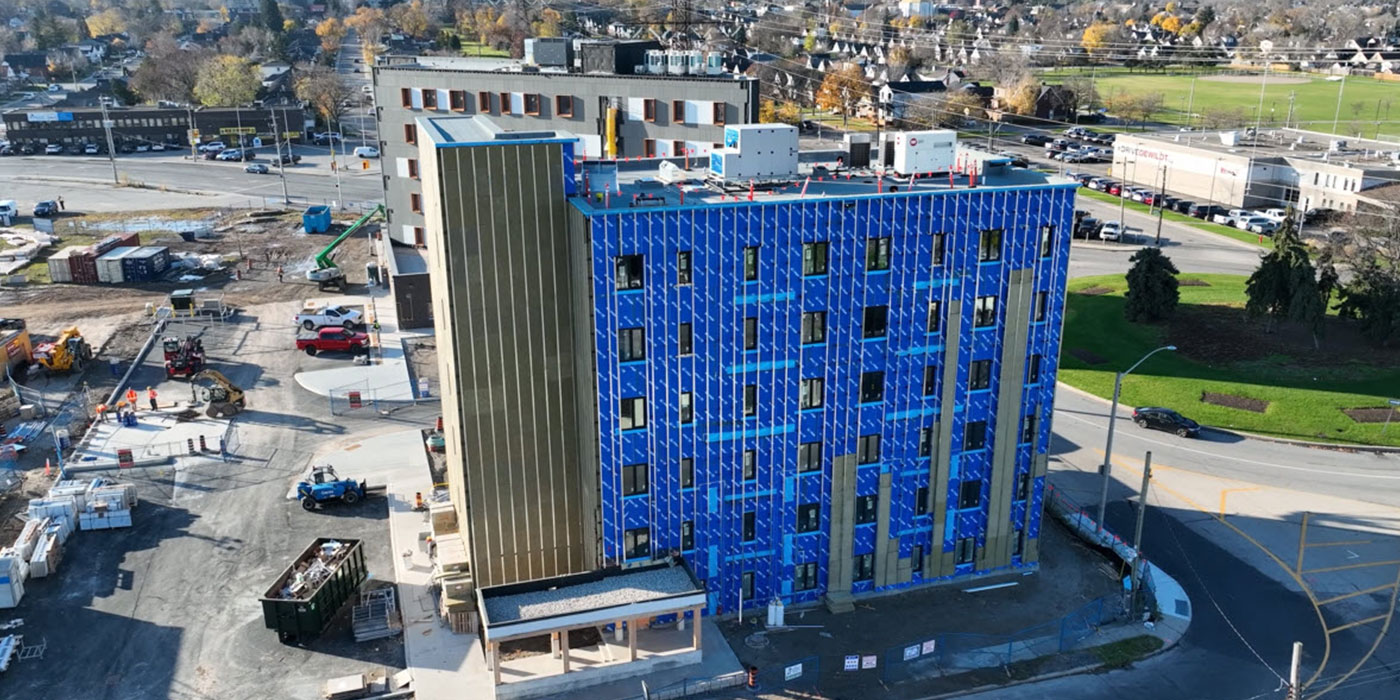 Aerial view mid-construction with weatherproofing barrier and insulation
