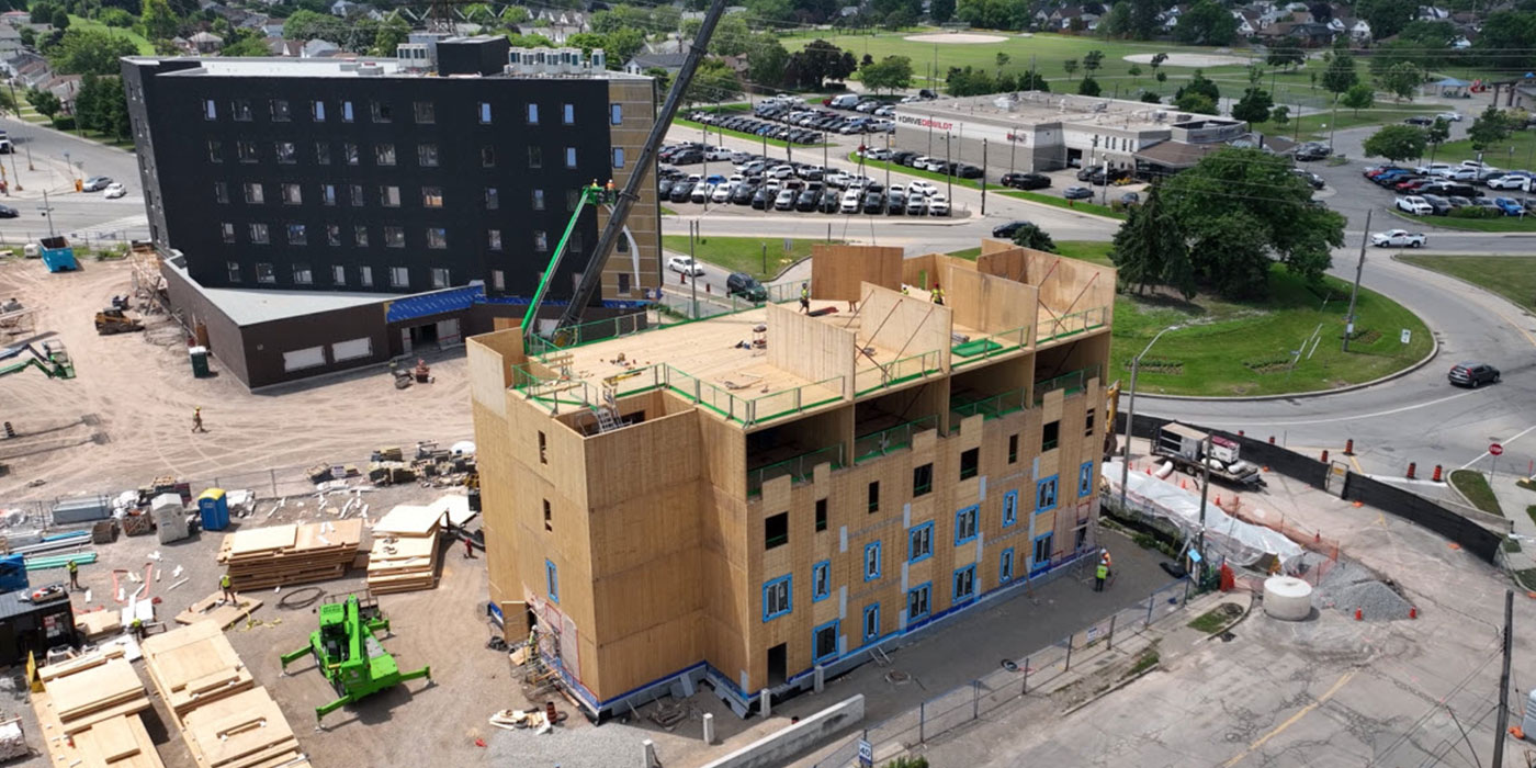 Four-storey structure with blue window flashing installed