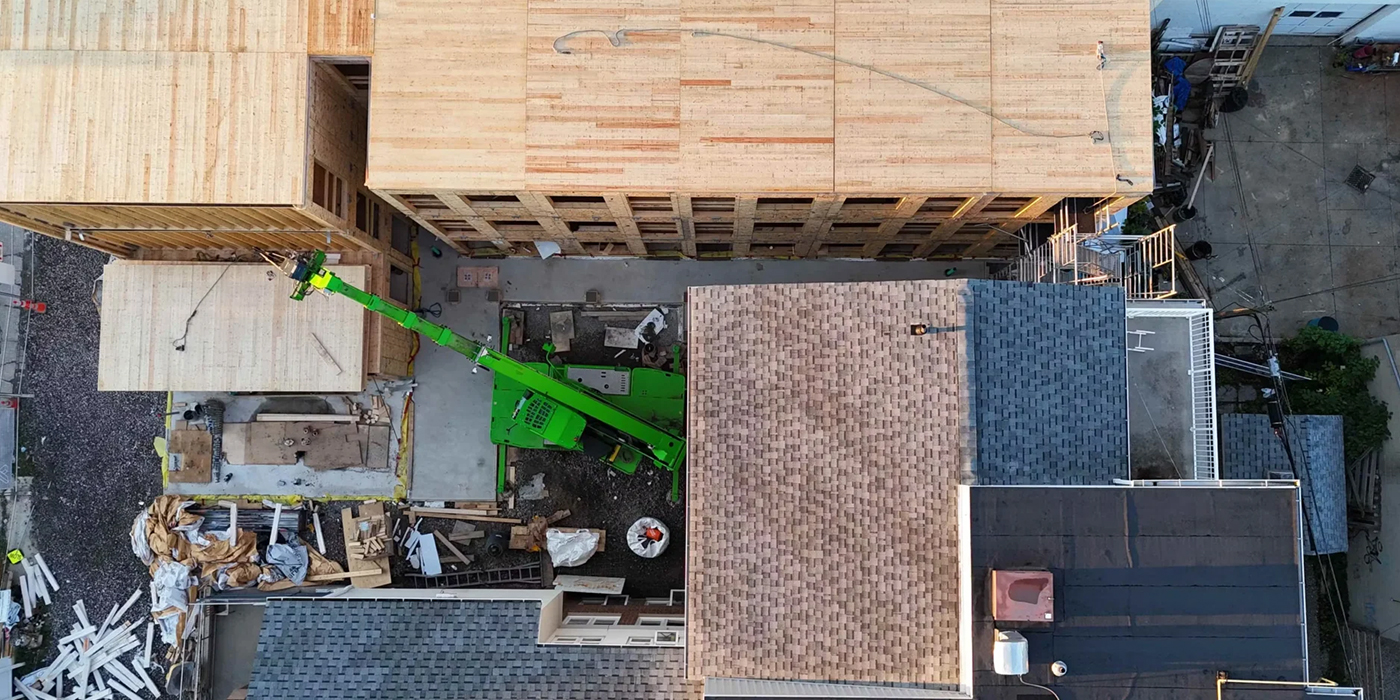Overhead view of panelized construction and lifting equipment