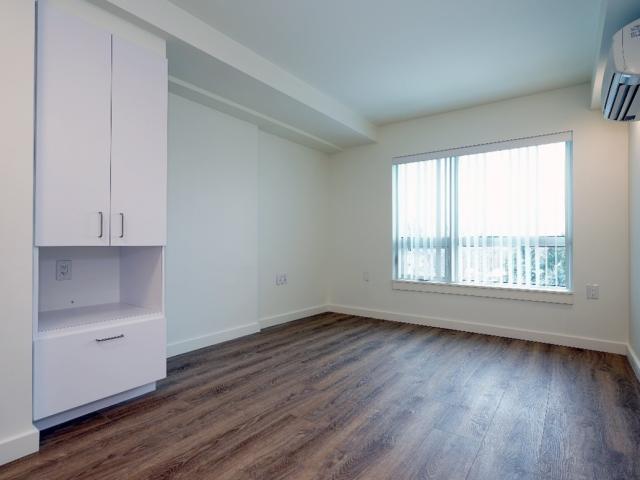 Unit interior with built-in storage and a large window