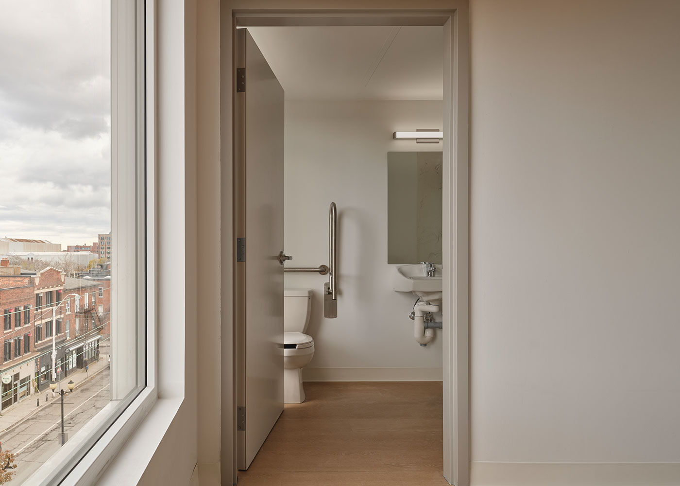 Accessible washroom beside a window overlooking Barton Street